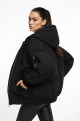 Black puffer jacket with hood and faux shearling lining, cozy winter outerwear for women.